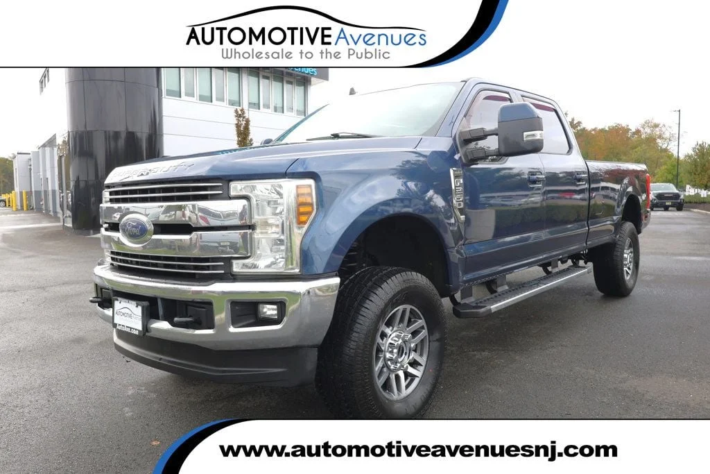 Used 2019 Blue Jeans Metallic Ford LARIAT 4WD Crew Cab 6.75