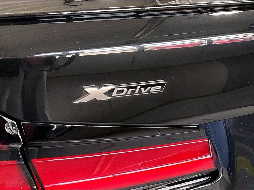 Used 2022 Black BMW M550i xDrive image 29
