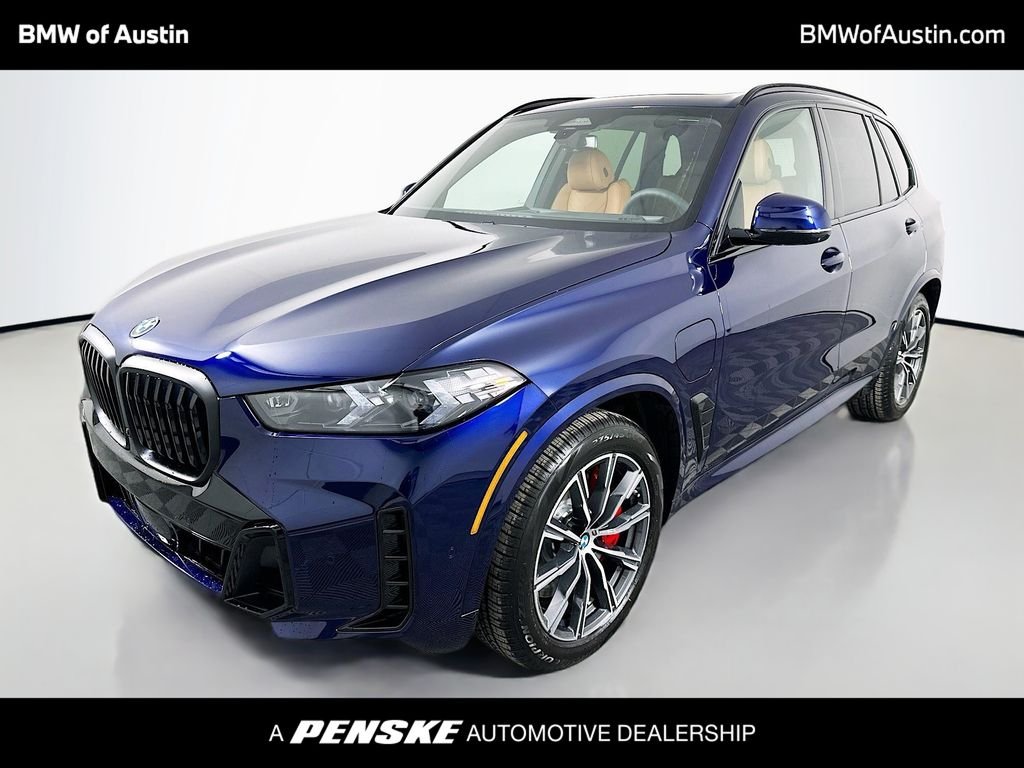 Used 2026 Tanzanite Blue II Metallic BMW xDrive50e image 1