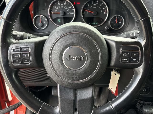 Used 2015 Orange Jeep Sahara image 17