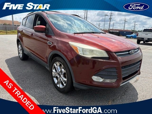 Used 2014 Orange Ford SE image 1