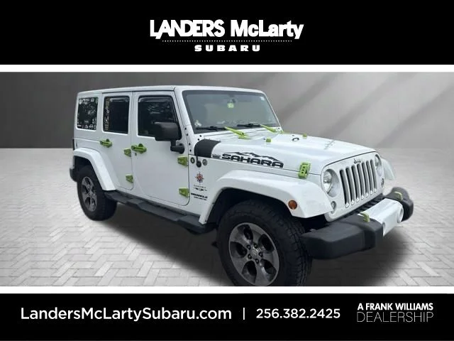 Used 2016 White Jeep Unlimited Sahara image 1