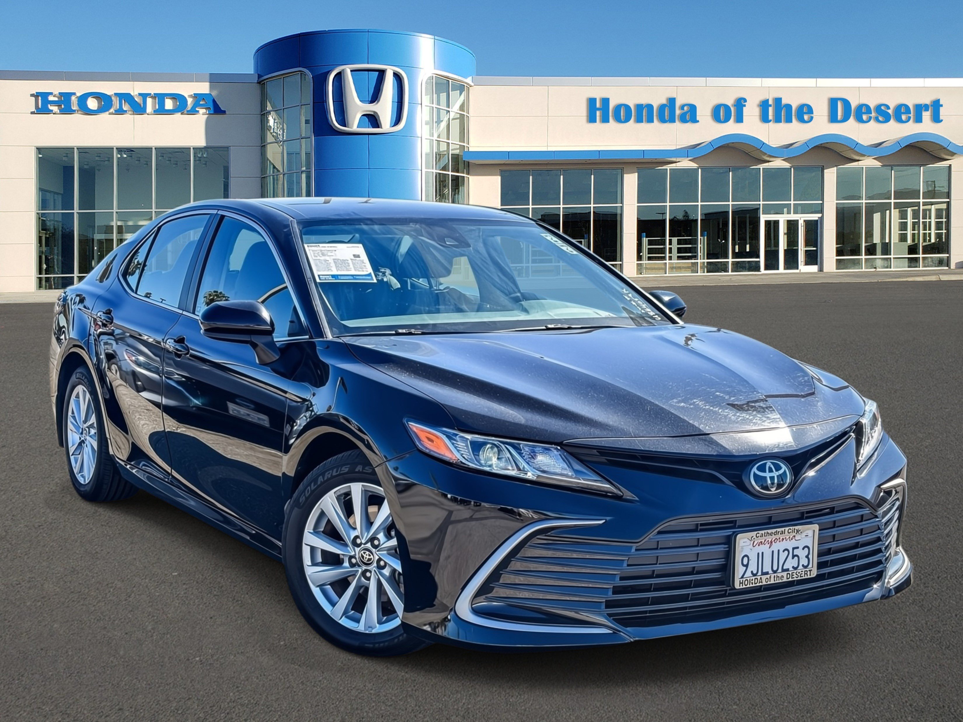 Certified Used 2024 Midnight Black Metallic Toyota LE image 1