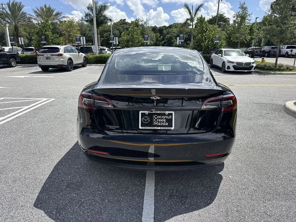 Used 2023 Solid Black Tesla  image 2