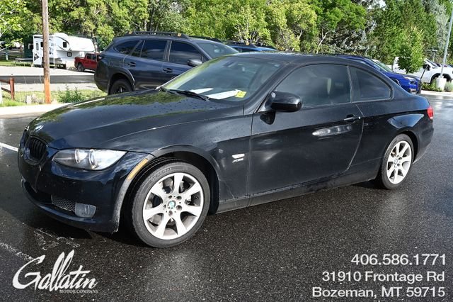 Used 2010 Black BMW 335i xDrive image 1