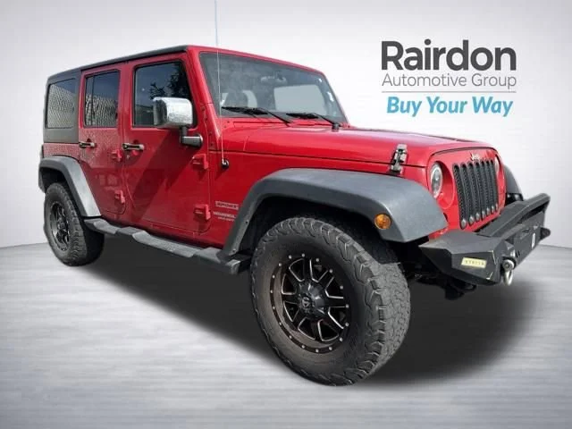 Used 2012 Flame Red Jeep Sport image 1