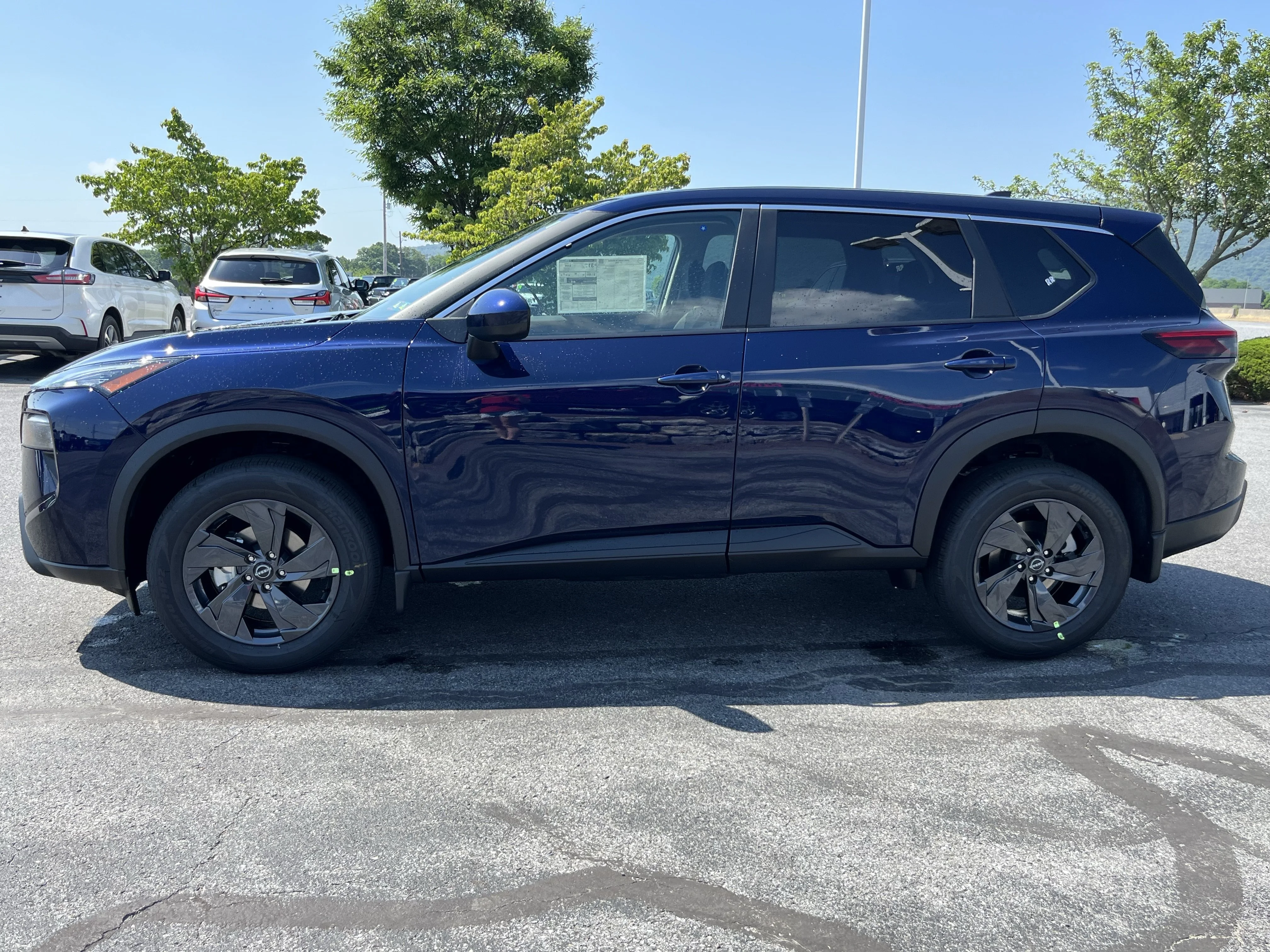 New 2026 Deep Ocean Blue Pearl Nissan SV image 10