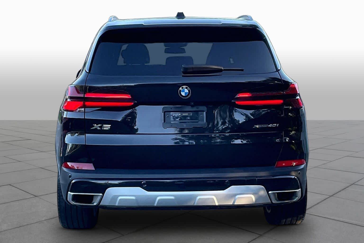 Certified Used 2024 Black Sapphire Metallic BMW xDrive40i image 4