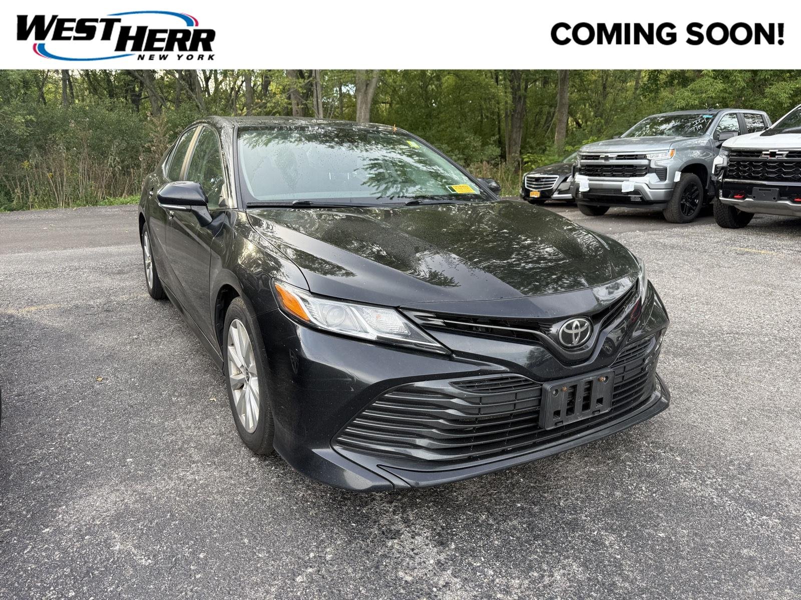 Used 2020 Midnight Black Metallic Toyota LE image 1