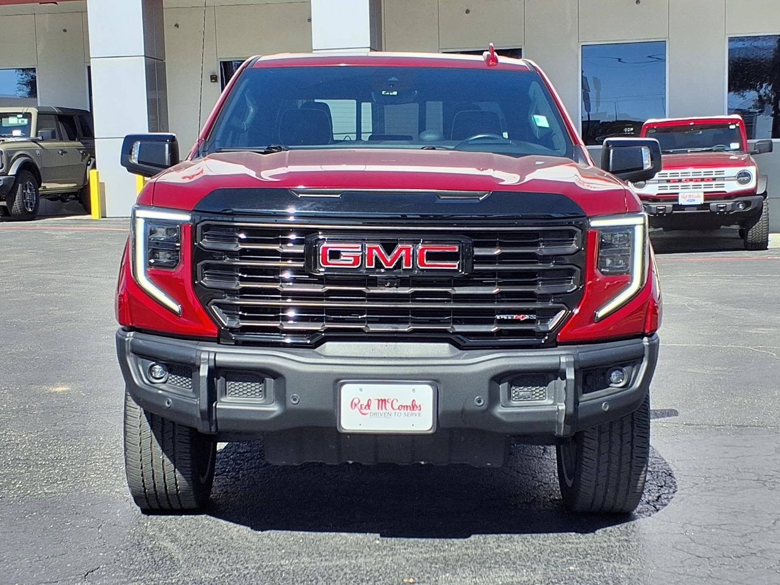 Used 2024 Volcanic Red Tintcoat GMC AT4X image 2
