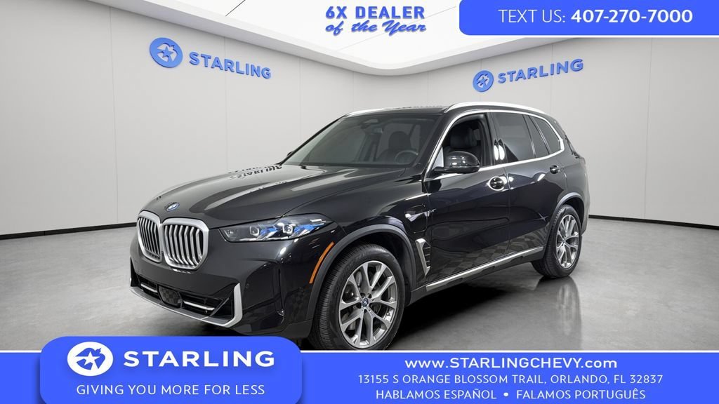 Used 2025 Black BMW xDrive50e image 1