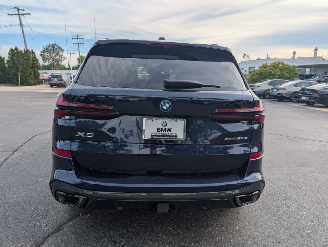 Certified Used 2026 Tanzanite Blue II Metallic BMW xDrive50e image 4