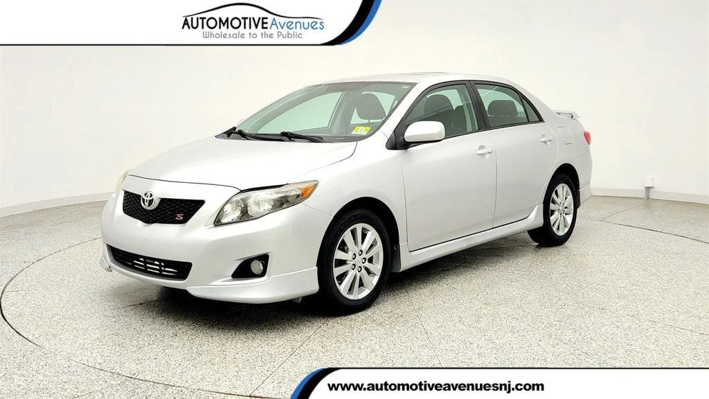 Used 2010 Classic Silver Metallic Toyota 4dr Sedan Manual S w/ Power Moonroof & 16
