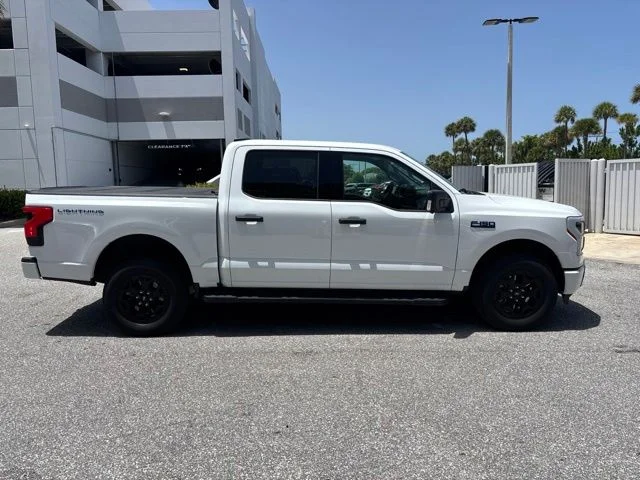 Used 2025 Ford F-150 Lightning XLT with VIN 1FTVW3LK3SWG05861 for sale in Delray Beach, FL