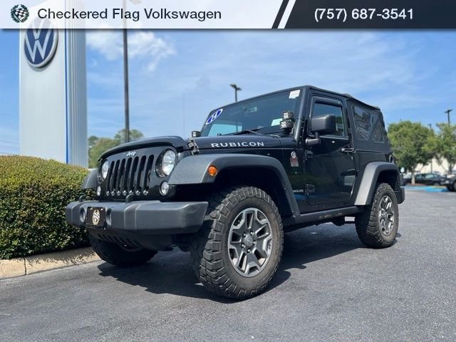 Used 2014 Black Clearcoat Jeep Rubicon image 1