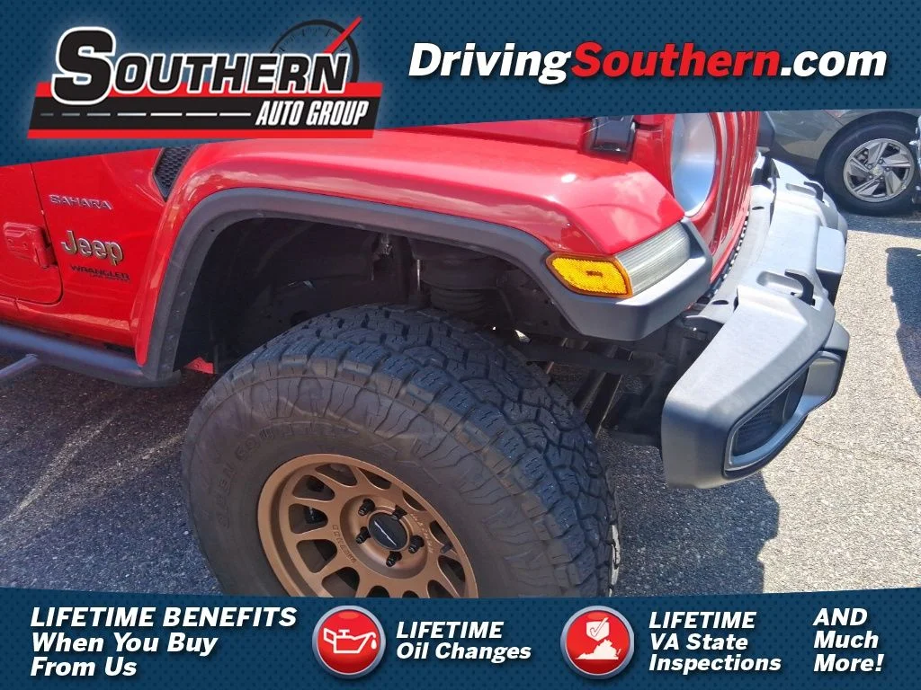 Used 2018 Red Jeep Unlimited Sahara image 1