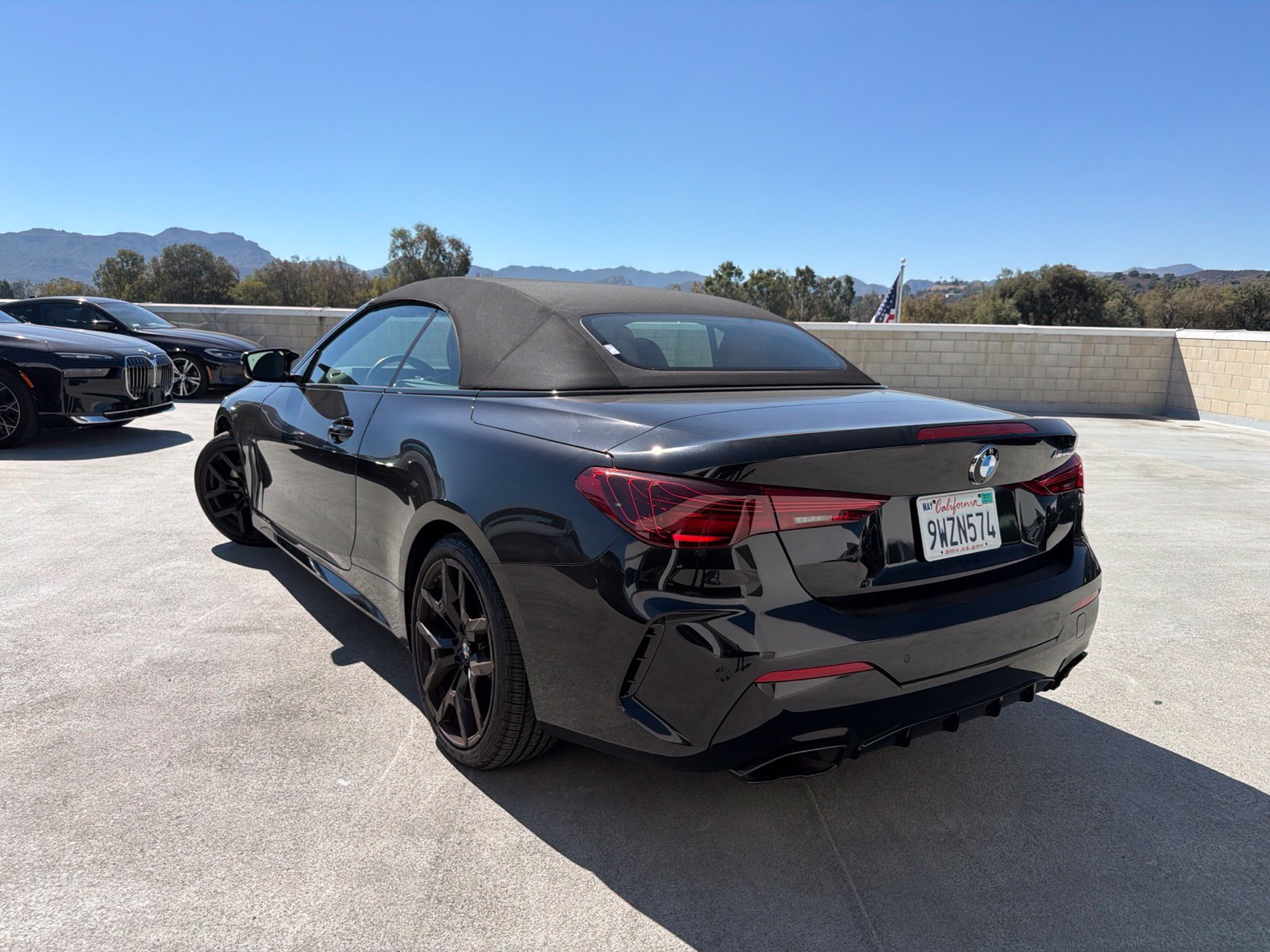 Used 2025 Black Sapphire Metallic BMW M440i image 2