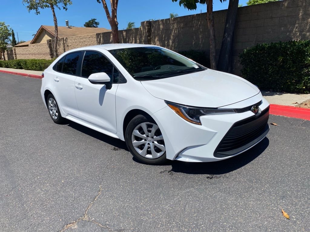 Used 2025 White Toyota LE image 1