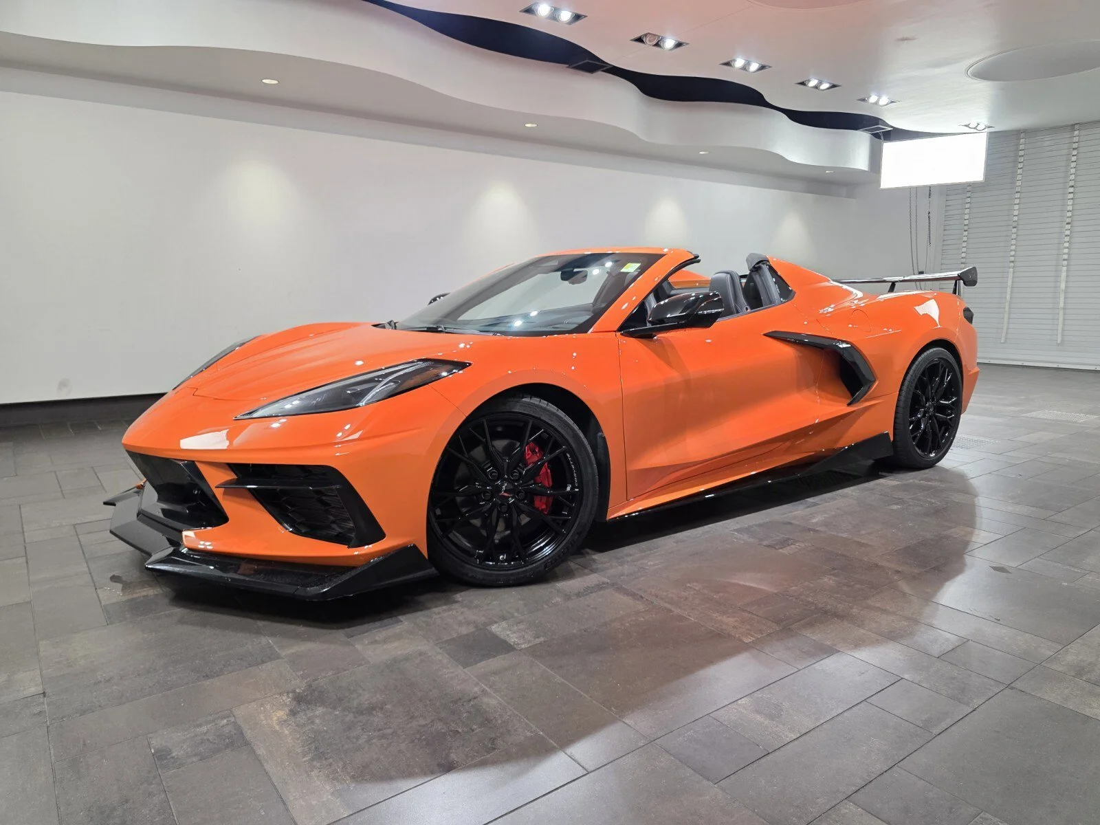 Used 2024 Amplify Orange Tintcoat Chevrolet Stingray Convertible 2LT image 1