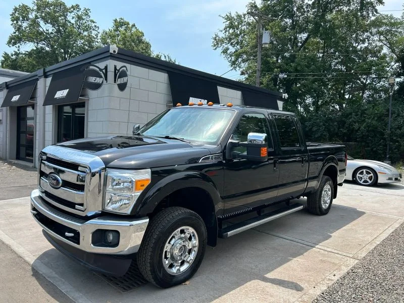 Used 2012 Black Ford Lariat Pickup 4D 6 3/4 ft image 1