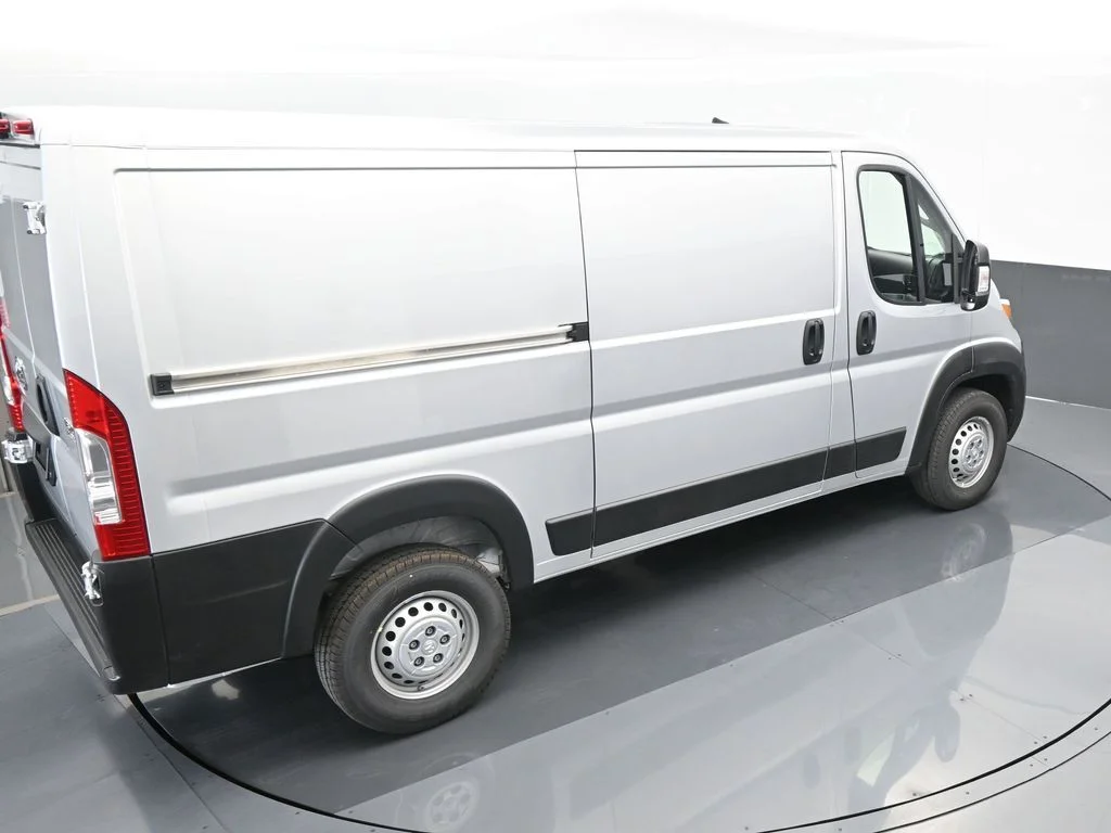 Used 2025 Bright Silver Clearcoat Metallic Ram Low Roof image 43