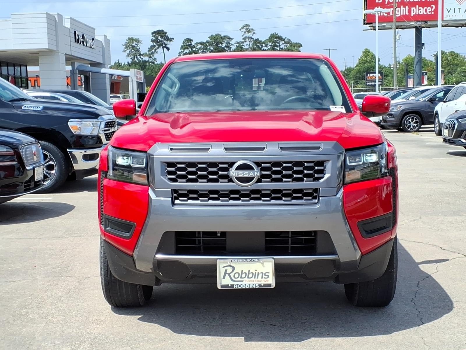 2026 Nissan Frontier SV Red at Robbins Nissan