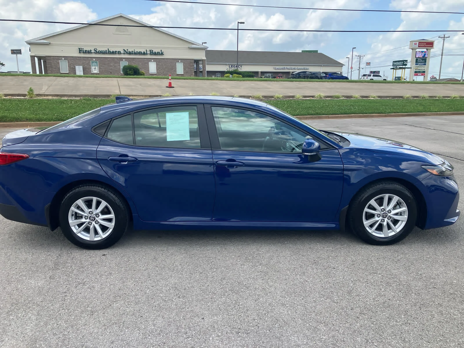 Used 2025 Reservoir Blue Toyota LE image 8