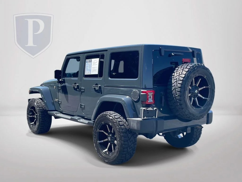 Used 2016 Black Jeep Unlimited Sahara image 6
