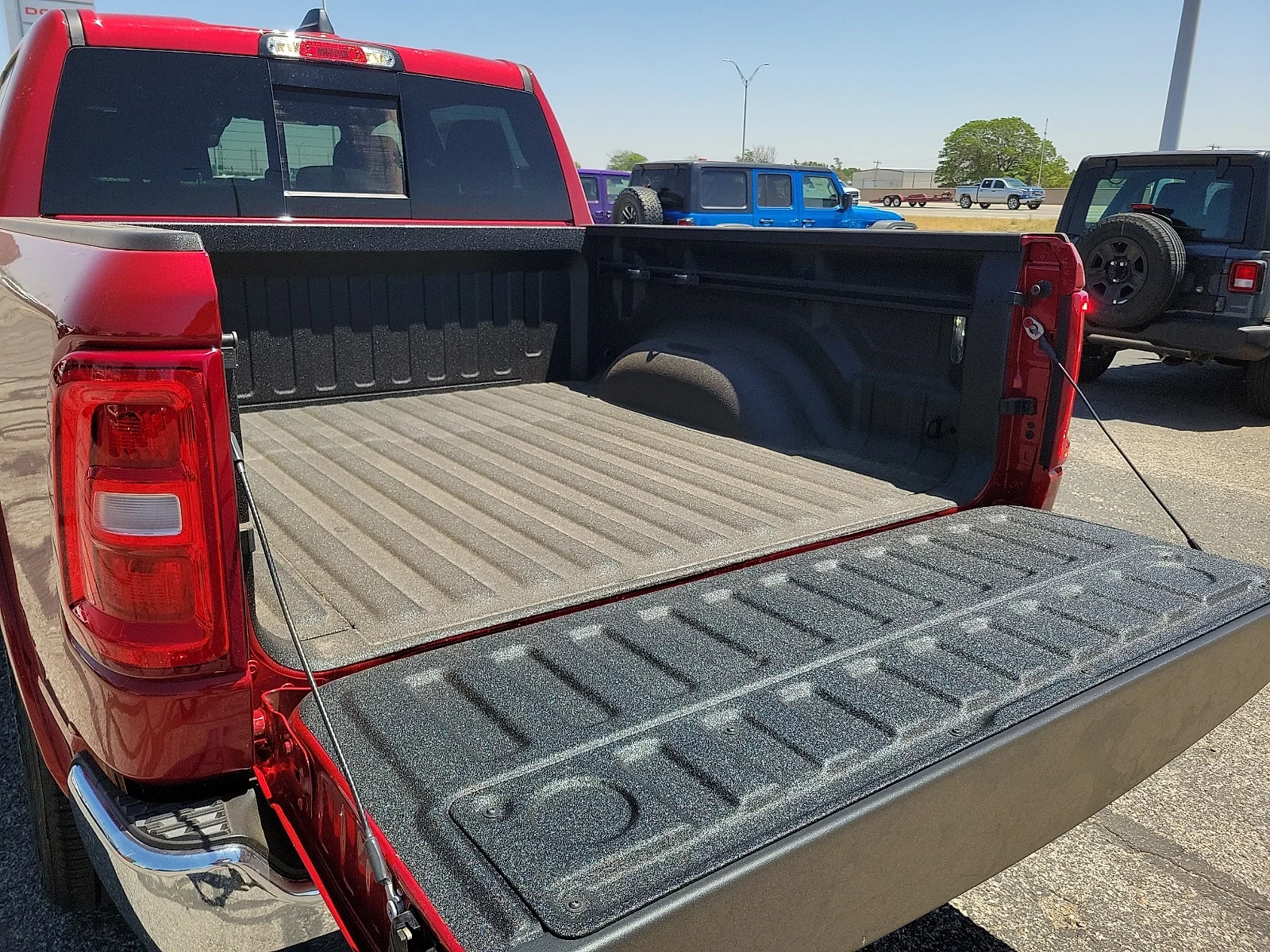 New 2026 Molten Red Pearlcoat Ram LONE STAR CREW CAB 4X4 5