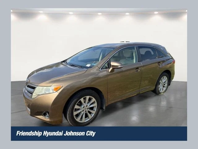 Used 2013 Gold Toyota LE image 1