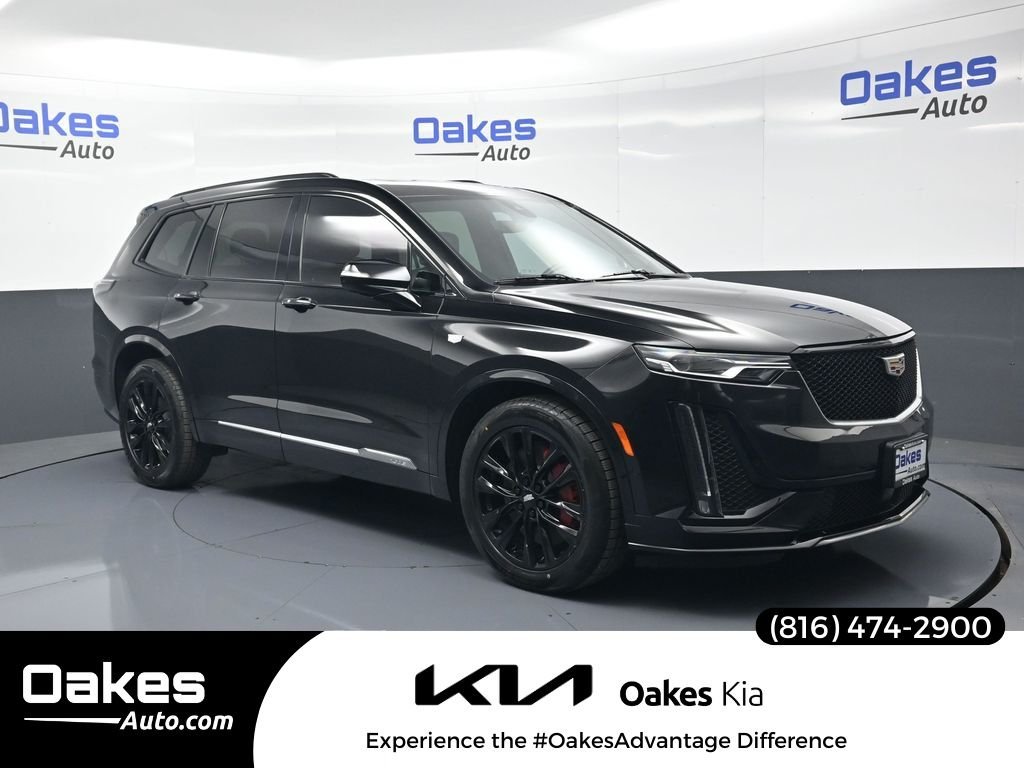 Used 2023 Stellar Black Metallic Cadillac Sport image 1