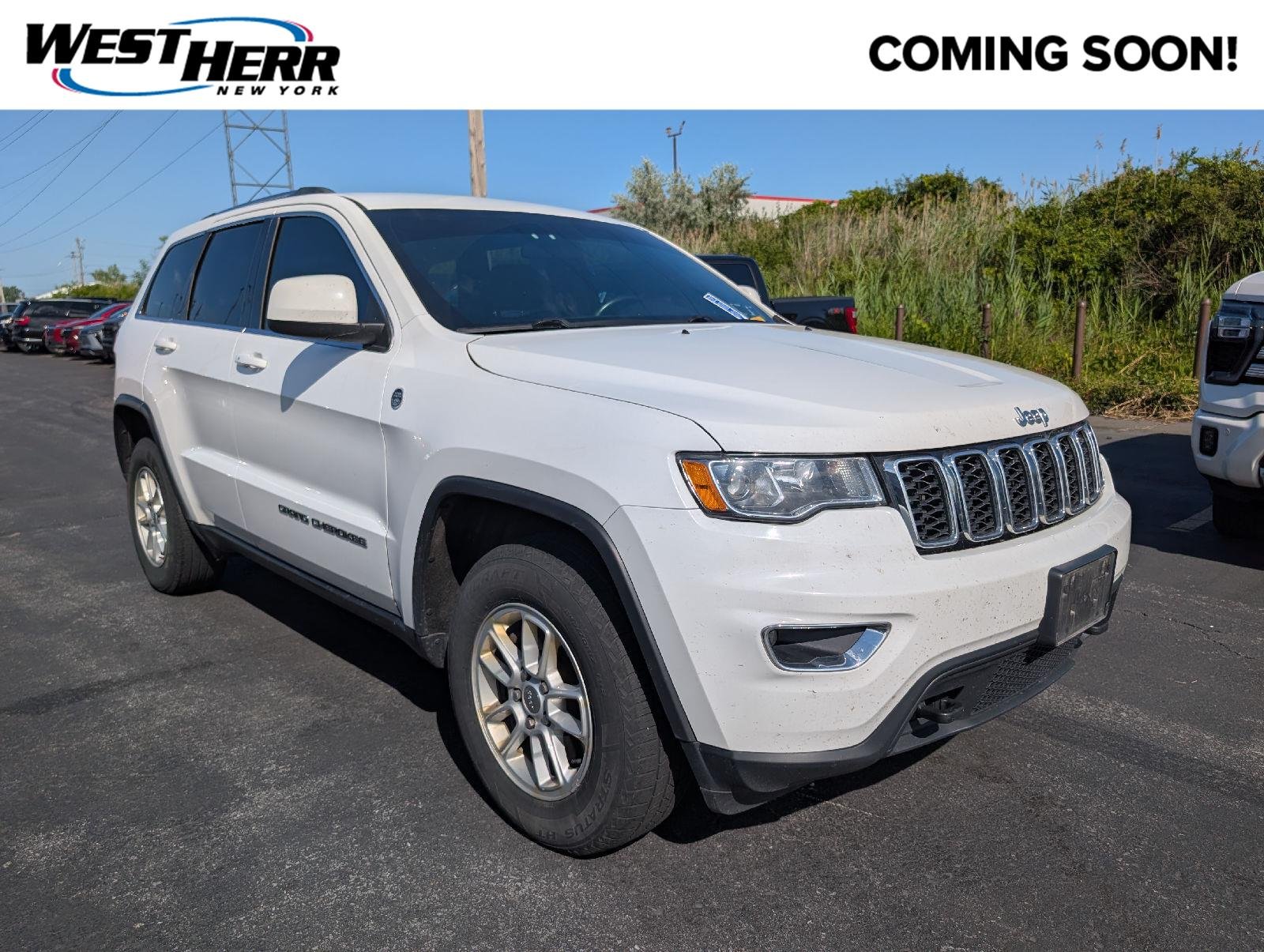 Used 2019 Bright White Clearcoat Jeep Laredo E image 1