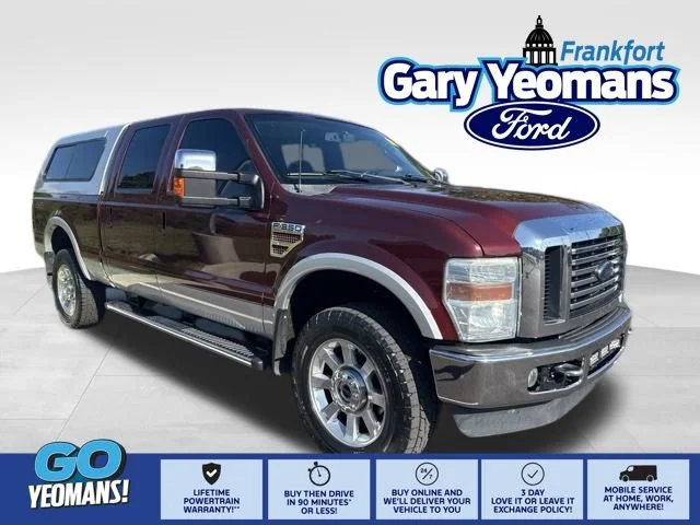 Used 2010 Royal Red Metallic Ford Lariat image 1