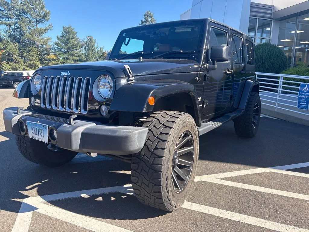 Used 2018 Black Jeep Unlimited Sahara image 2