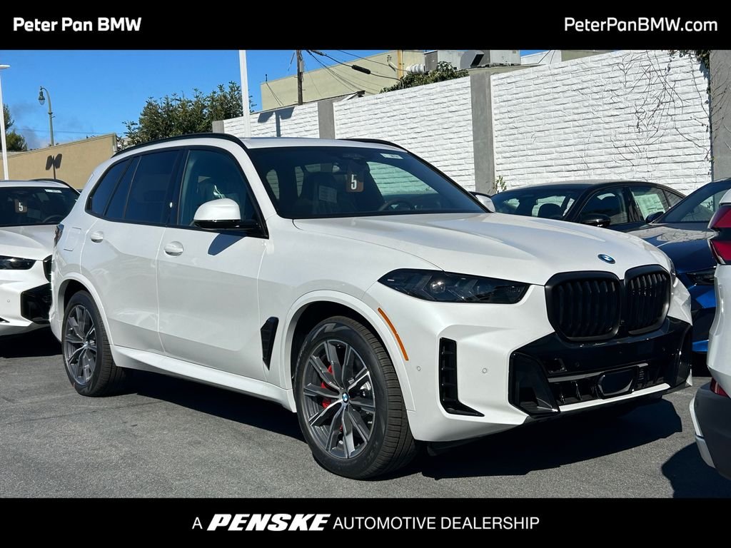 New 2026 Mineral White Metallic BMW xDrive50e image 1