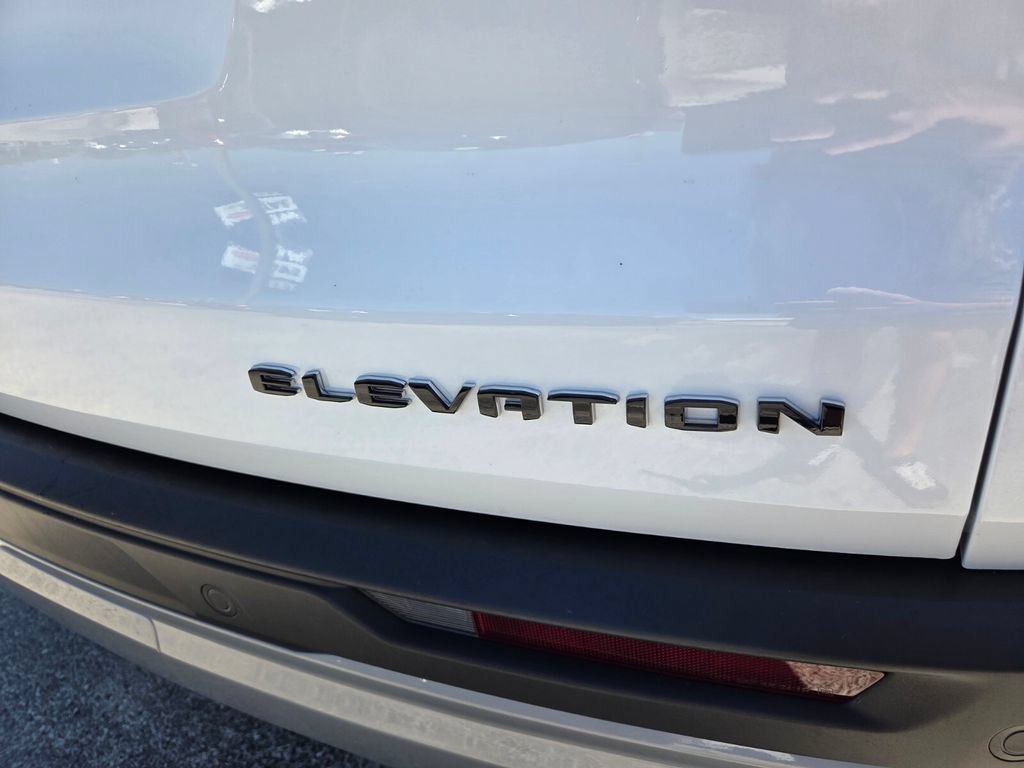 Used 2025 Summit White GMC FWD Elevation image 15