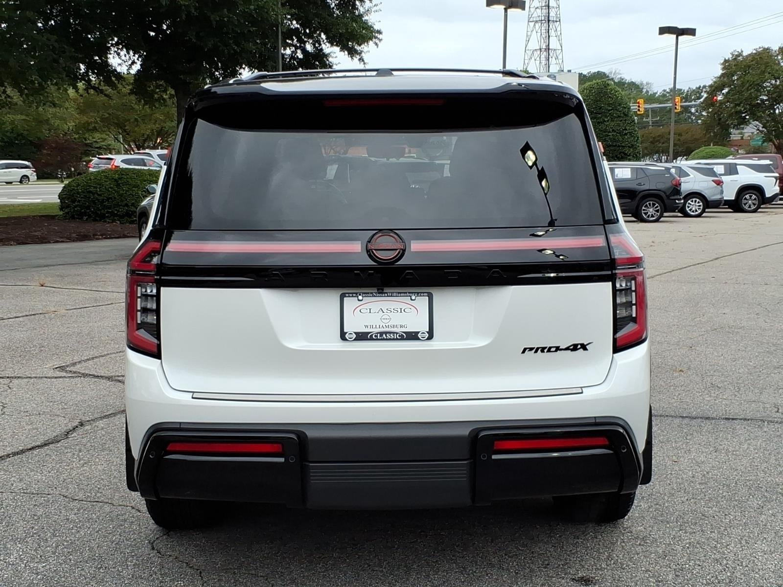 Used 2025 Aspen White Tricoat/Super Black Nissan PRO-4X image 8