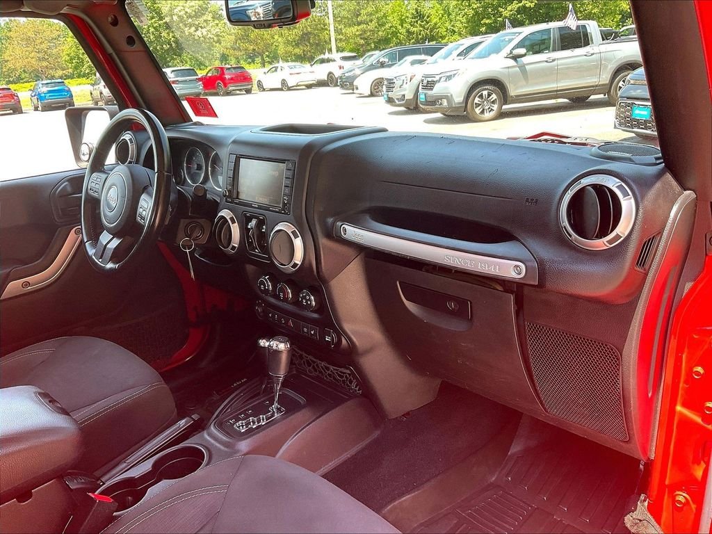 Used 2015 Red Jeep Unlimited Sahara image 14