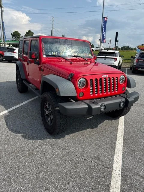 Used 2016 Firecracker Red Clearcoat Jeep Unlimited Sport image 1