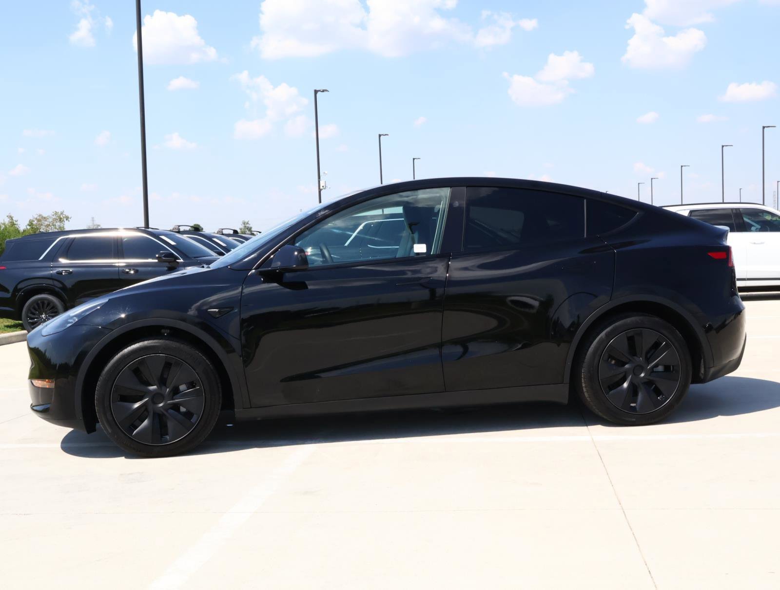 Used 2025 Tesla Model Y Long Range with VIN 7SAYGAEE5SF305140 for sale in Friendswood, TX