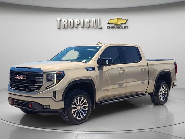 Used 2023 Desert Sand Metallic GMC AT4 image 1