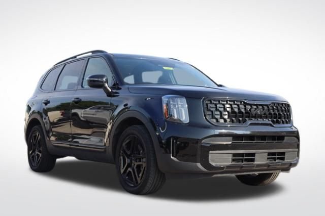 Used 2025 Ebony Black Kia EX X-Line image 1