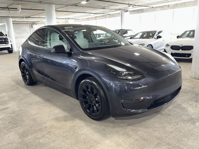 Used 2024 Tesla Model Y Long Range with VIN 7SAYGDEE7RA234869 for sale in Wesley Chapel, FL