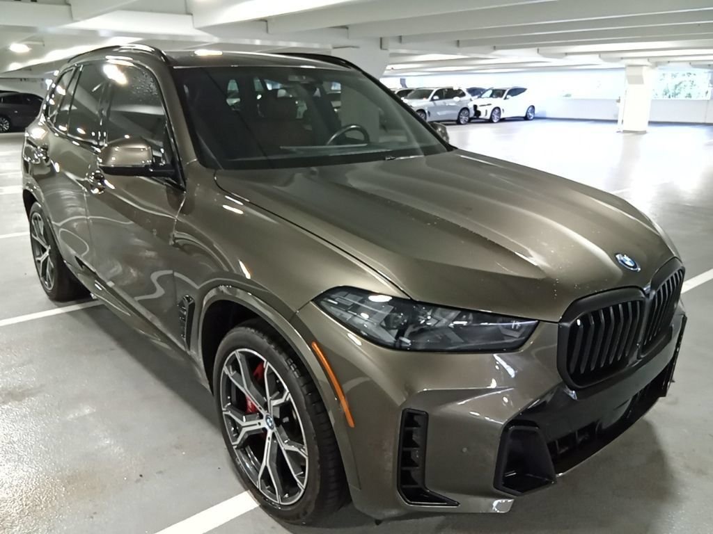 Used 2024 Manhattan Green Metallic BMW xDrive50e image 3
