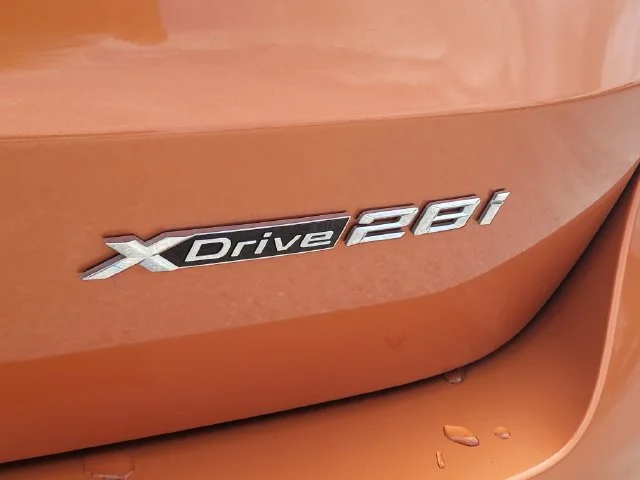 Certified Used 2023 Orange BMW xDrive28i image 9