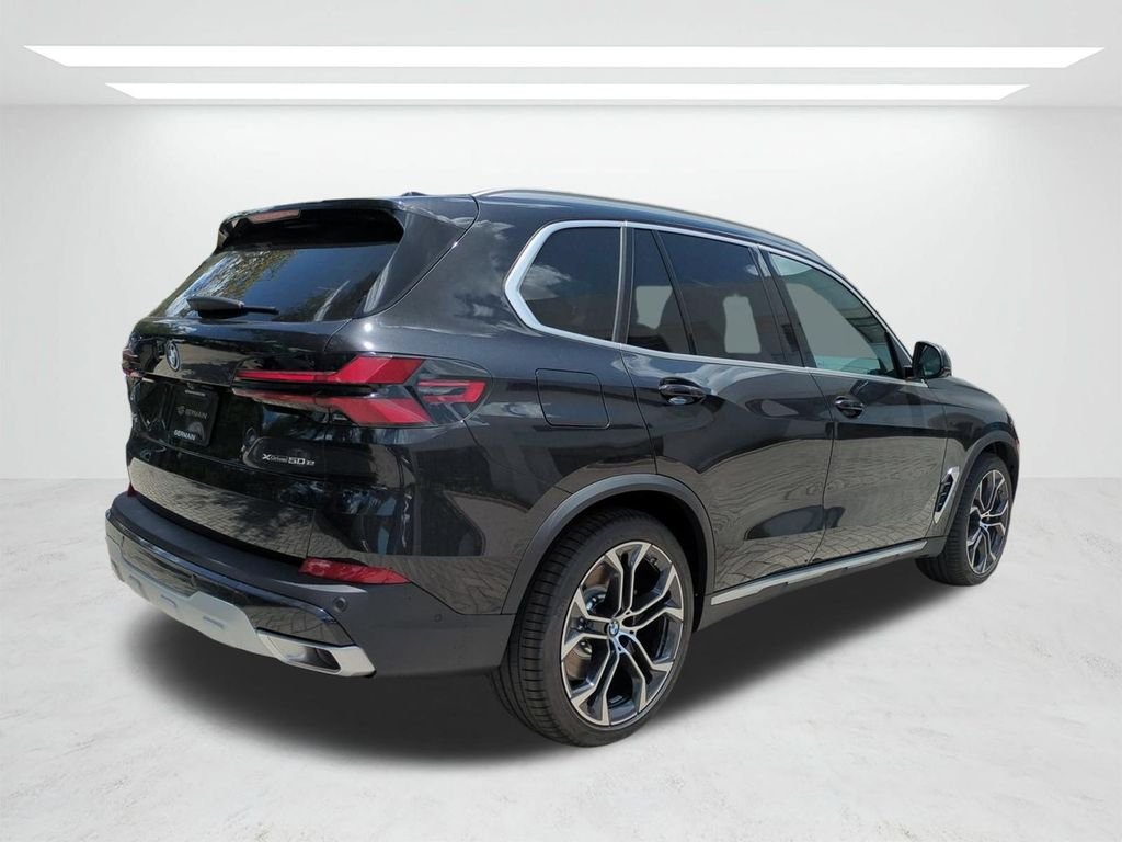 New 2026 Black Sapphire Metallic BMW xDrive50e image 4