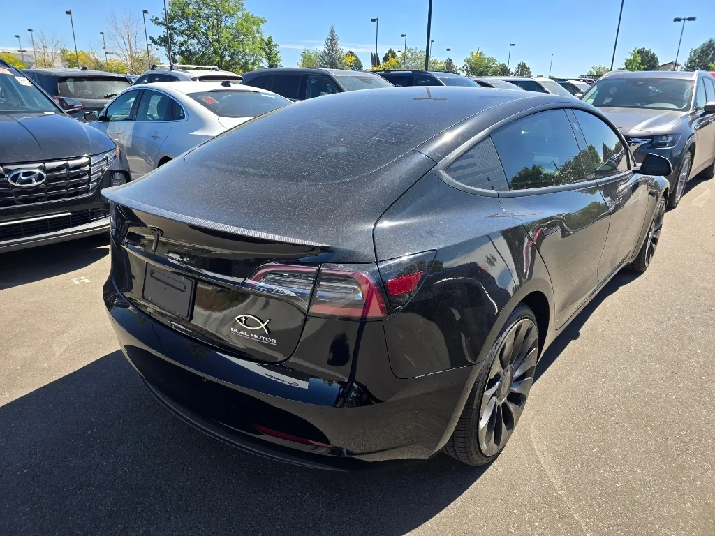 Used 2022 Solid Black Tesla Performance image 15