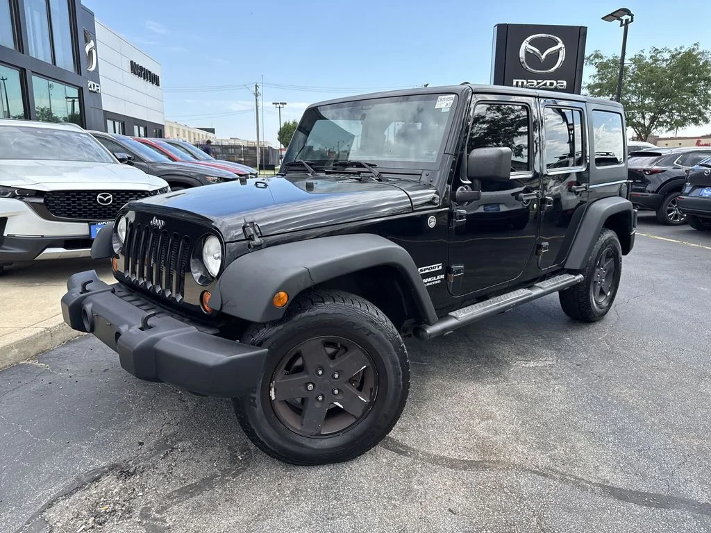 Used 2013 Black Jeep Unlimited Sport image 7