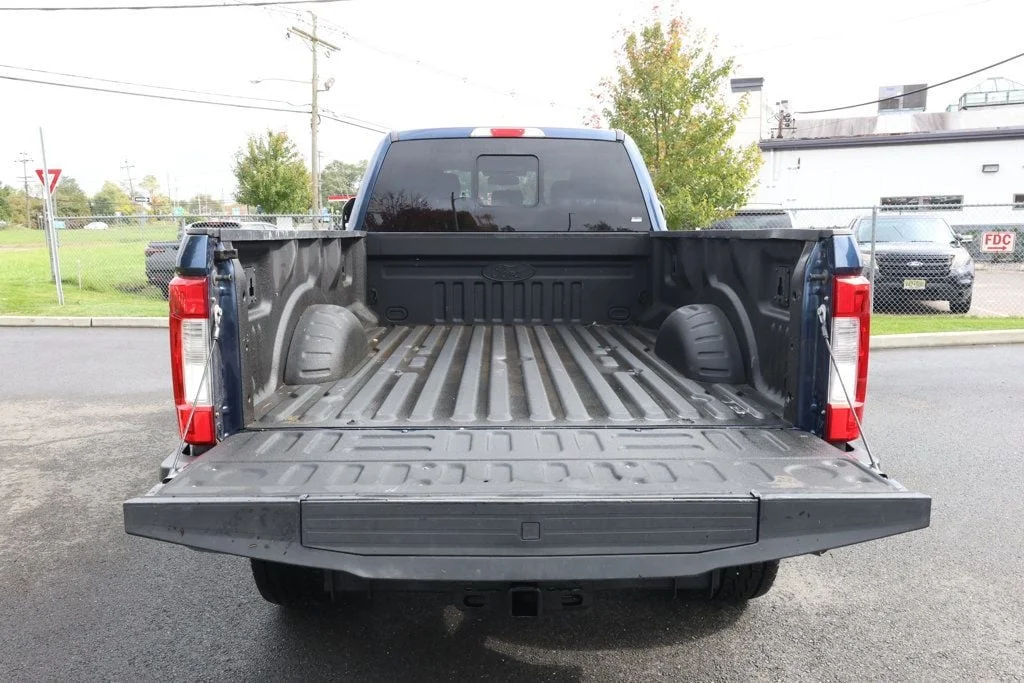 Used 2019 Blue Jeans Metallic Ford LARIAT 4WD Crew Cab 6.75