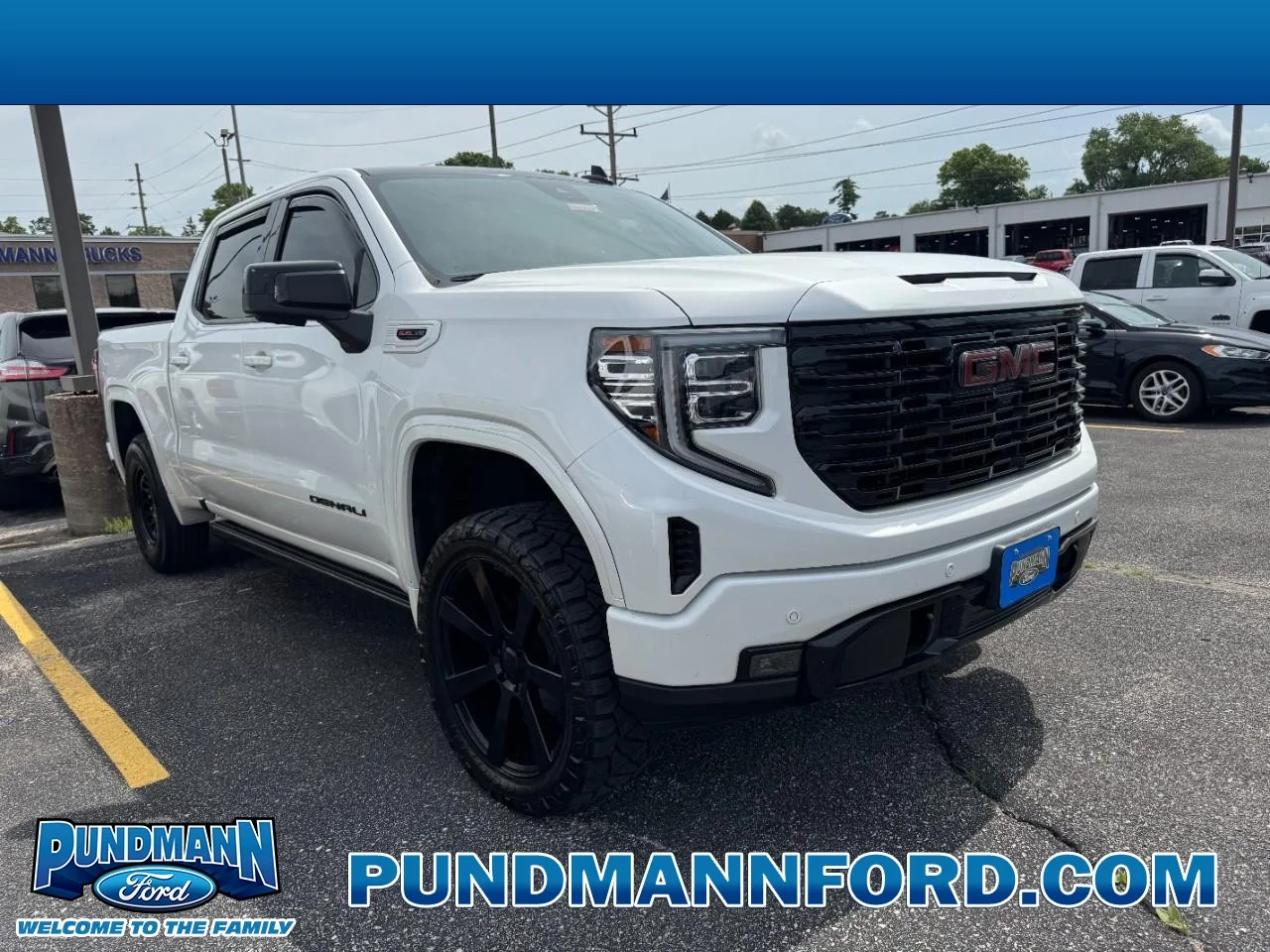 Used 2023 Summit White / White GMC 4WD Crew Cab 147" Denali image 1